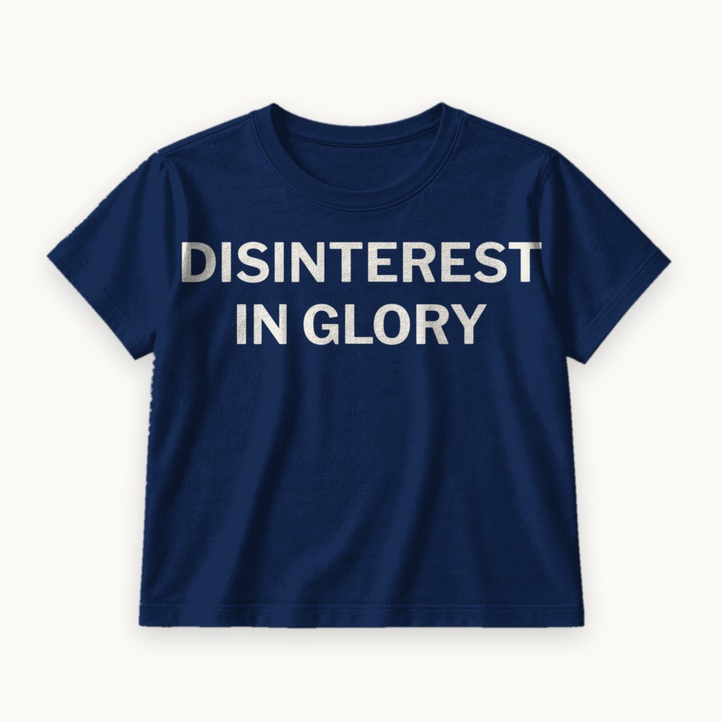 Disinterest in Glory printed on a Navy tee — product photography