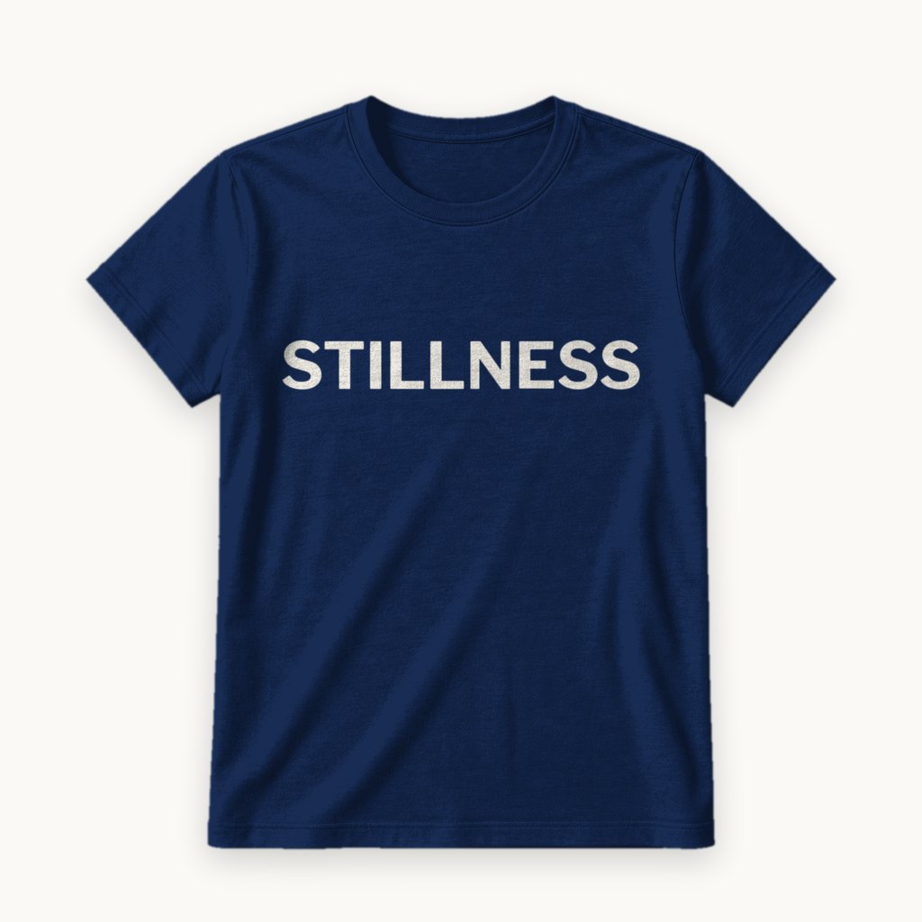 Stillness printed on a Navy tee — product photography