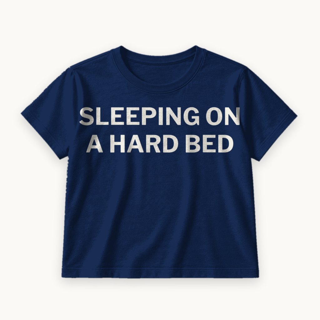 Sleeping on a Hard Bed printed on a Navy tee — product photography